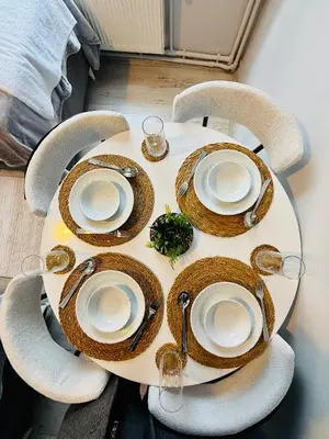 a table with plates of food on top of it at Cozy yellow home in Istanbul