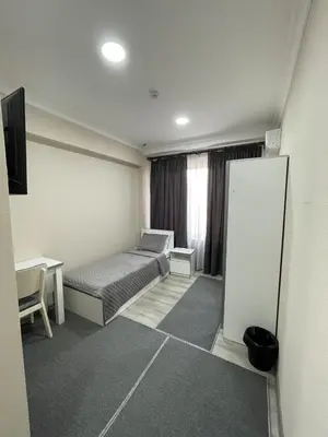 a room with a bed and a desk and a mirror at Elma hotel in Istanbul