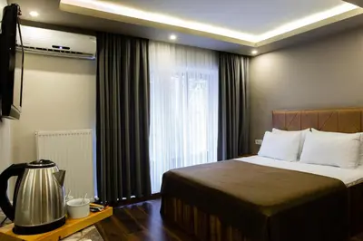a hotel room with a bed and a window at Taksm Mood in Istanbul