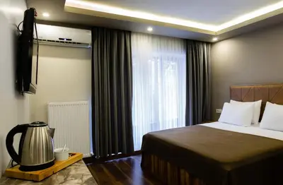 a hotel room with a bed and a window at Taksm Mood in Istanbul