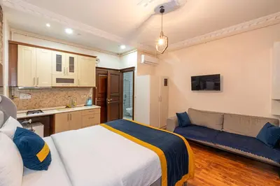 a bedroom with a bed and a couch in a room at Opêra house taksim in Istanbul