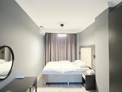 a hotel room with a bed and a mirror at Birru Suites in Istanbul