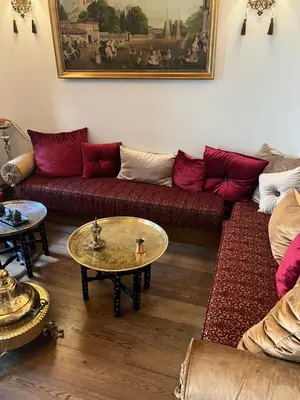 a living room with a couch and a table at Big Apple hotel istanbul in Istanbul