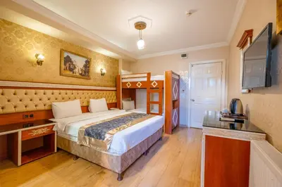 a hotel room with a bed and a television at Big Apple hotel istanbul in Istanbul