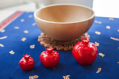 three red tomatoes on a blue table with a bowl at Newly-renovated apartment 2 in Istanbul