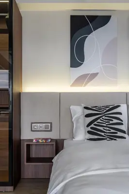 a bedroom with a bed and a picture on the wall at Historic34 Modern Cozy Apartment Golden Horn in Istanbul