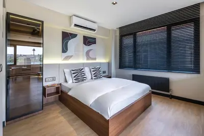a bedroom with a large bed and a window at Historic34 Modern Cozy Apartment Golden Horn in Istanbul
