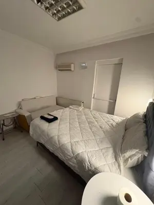a bedroom with a bed with a comforter on it at Üsküdar Sahil Konaklama in Istanbul