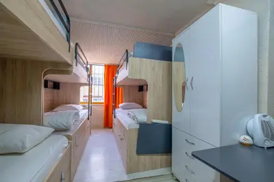 a room with three bunk beds in a room at Çatal hostel in Istanbul