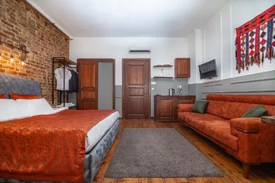 a bedroom with a bed and a couch at Stories Of Galata in Istanbul