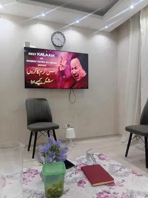 a flat screen tv hanging on a wall at Sağlam Apartments in Istanbul
