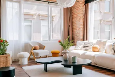 a living room with a couch and a table at Stunning City View Luxury Flat by Galata Metro in Istanbul