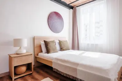 a white bedroom with a bed and a window at Stunning City View Luxury Flat by Galata Metro in Istanbul