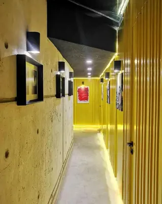 a hallway with yellow walls and a long hallway with yellow walls at Baraka 1 in İznik