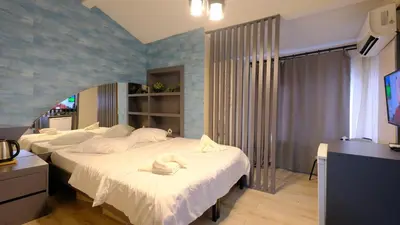 a bedroom with two beds with towels on them at Marine Suite in Istanbul