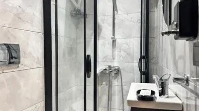 a bathroom with a shower and a sink at Marine Suite in Istanbul