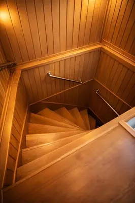 a wooden staircase in a room with wood paneling at Hes Sultanahmet Tenedos in Istanbul