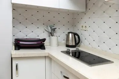 a kitchen with a sink and a counter top at Amoria House Sultanahmet in Istanbul