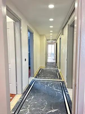 an empty hallway with ailed floor in a building at Ekinci Plaza in Istanbul