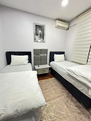 a bedroom with two beds and a window at Ekinci Plaza in Istanbul