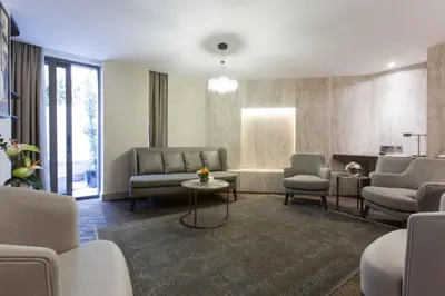 a living room with couches and chairs and a table at Noble22 Suites-Special Category in Istanbul