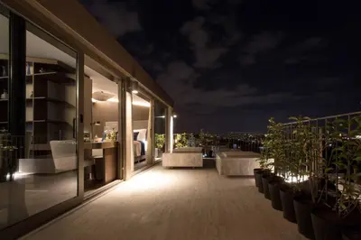 a balcony of a building at night with plants at Noble22 Suites-Special Category in Istanbul