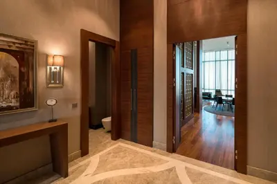 a hallway of a home with wooden walls and doors at Sheraton Grand Istanbul Atasehir in Istanbul