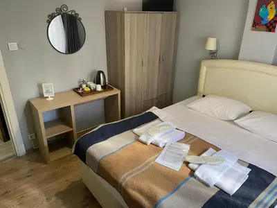a bedroom with a bed with two towels on it at Goji's Apartments in Istanbul