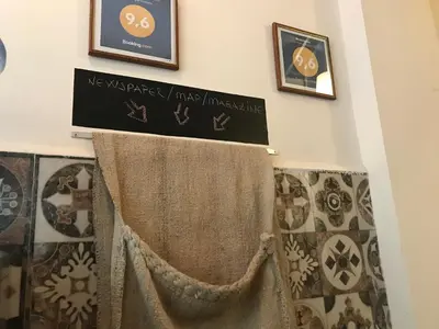 a sign above a window in a room at Goji's Apartments in Istanbul