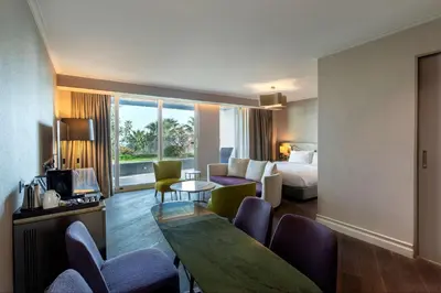 a hotel room with a bed and a table and chairs at Radisson Blu Hotel Istanbul Ottomare in Istanbul
