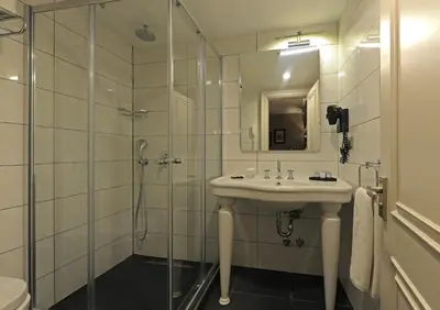 a bathroom with a sink and a shower at Le Petit Palace Hotel - Special Category in Istanbul