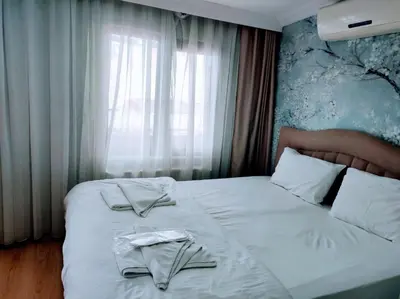a hotel room with two beds with towels on them at Seyri Istanbul Hotel in Istanbul