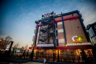 a building with a sign on the side of it at Business Palas Otel in Kocaeli