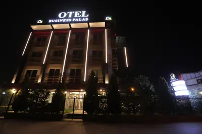 a building with a sign on top of it at night at Business Palas Otel in Kocaeli