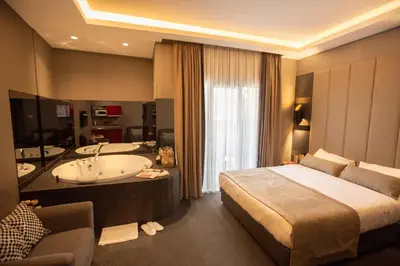 a hotel room with a bed and a bath tub at Cityloft 24 in Istanbul
