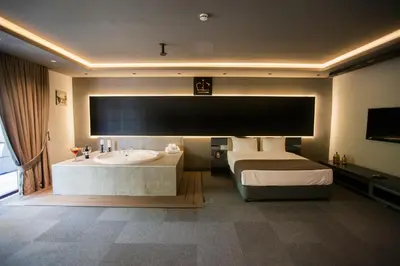 a hotel room with a bed and a tub and a sink at Cityloft 24 in Istanbul