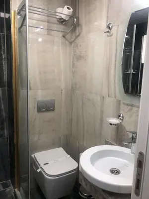 a small bathroom with a toilet and a sink at Glamour Hotel Istanbul Sirkeci in Istanbul