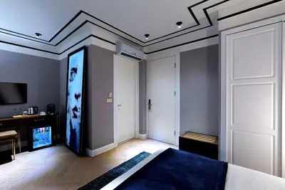 a bedroom with a large painting on the ceiling at Walton Hotels Galata in Istanbul