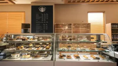 a display case filled with different types of pastries at ADM Grand Hotel in Istanbul