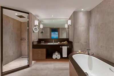 a bathroom with a tub and a sink at Renaissance Polat Istanbul Hotel in Istanbul