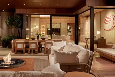 a living room with a couch and a dining room at The Ritz-Carlton, Istanbul at the Bosphorus in Istanbul