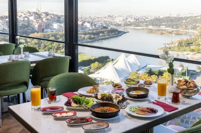 a table with food on it with a view at Arise Hotel Golden Horn in Istanbul