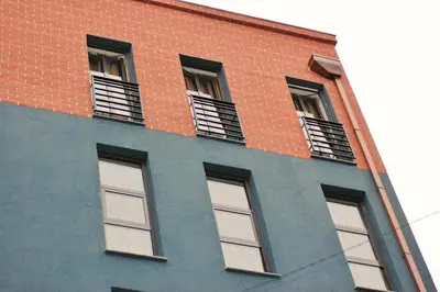 a brick building with four windows on it at Vavien Hotel in Istanbul