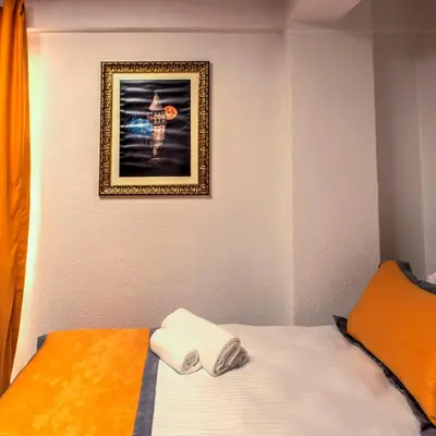 a bed in a room with a picture on the wall at Vavien Hotel in Istanbul