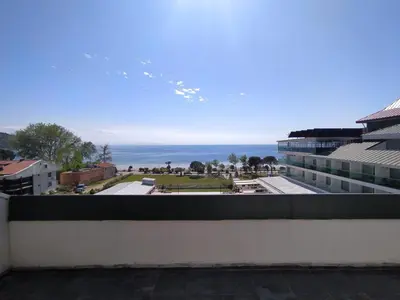 a view of the ocean from the balcony of a building at Ceti̇n Presti̇ge Resort in Erdek