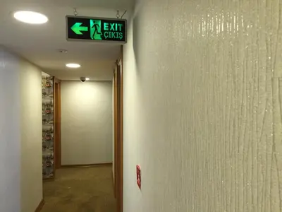 a exit sign on the wall of a building at Okur Otel in Istanbul