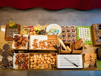 a display of different types of bread and pastries at Ibis Istanbul West in Istanbul