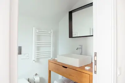 a bathroom with a sink and a mirror at Serguzest Otel in Buyukada