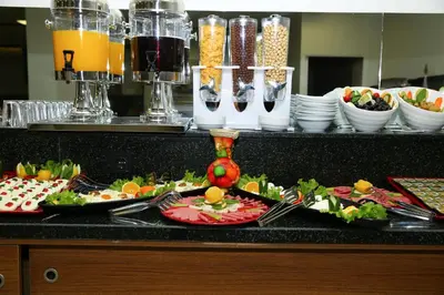 a buffet with plates of food on a table at Golden Lounge Hotel in Istanbul