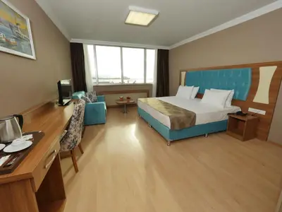 a hotel room with a bed and a desk at Golden Lounge Hotel in Istanbul